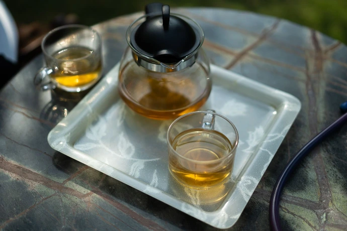Herbal detox tea served in a glass kettle at Tapasya Health & Wellness Ayurveda centre