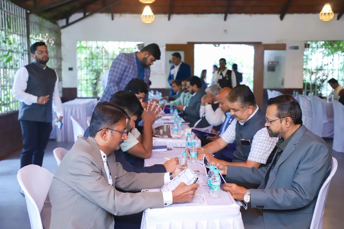 Corporate team seated at a group wellness workshop at Tapasya Health & Wellness