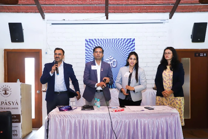 Tapasya team presenting at a corporate wellness programme event at Tapasya Health & Wellness